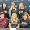 WESCLIN SENIOR ERIN HARPSTRITE signs to play softball at Greenville University. Front row (L to R): Brian Harpstrite, Erin Harpstrite, Sandi Harpstrite. Back row (L to R): Kaylee Korte, Kendyll Koester, Angie Timmermann, Kim Griffith, and Aaron Ward