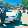 BILL AND KAY AHAUS OF RURAL TRENTON in front of their Tesla Y, which was one of three models of the Tesla vehicles on display at the Electric Car Show, this past Sunday. They purchased
the car in March of 2022 and said it charges on a 220 volt outlet at their home for six hours to be
fully charged.