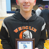 Photo by Matt Fridley
WESCLIN JUNIOR Grant Fridley
proudly displays his newly
won plaque from the Mater Dei
Holiday Tournament. The junior
was one of six players to
be so honored.